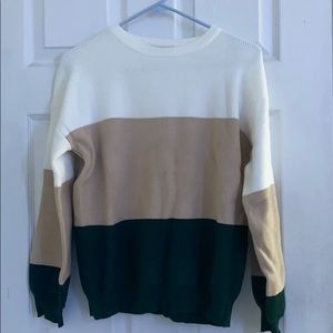 White, tan and dark green sweater